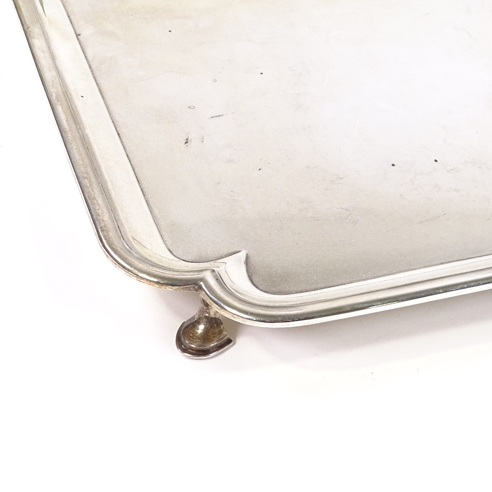 A large square silver tray, scalloped corners, by Thomas Bradbury & Sons Ltd, hallmarks Sheffield