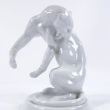 A Meissen white glazed porcelain leopard, restored