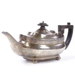 A George V silver teapot, oval squat form with bun feet, by Joseph Rodgers & Sons, hallmarks