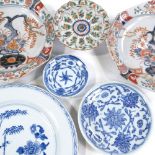 A group of Chinese and Japanese porcelain plates and bowls, including a pair of Japanese Arita
