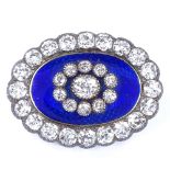 An Antique unmarked gold royal blue enamel and diamond cluster oval pendant / brooch, central engine