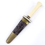 A sailor's dagger with carved ivory hilt and relief carved mermaid design whalebone scabbard,