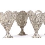 A set of 6 Maltese unmarked silver filigree egg cups, two of each design, with pierced and woven