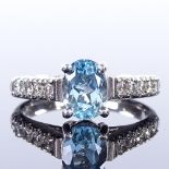 An 14ct white gold aquamarine and diamond dress ring, total diamond content approx 0.4ct, setting