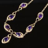 A 14ct gold amethyst and split pearl collar necklace, pierced and scrolled decoration with pear-