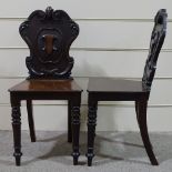 A pair of Victorian mahogany hall chairs with shield-shaped backs