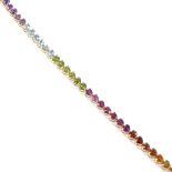 An 18ct gold heart-cut multi-gem line bracelet, including amethyst, topaz, peridot and citrines,