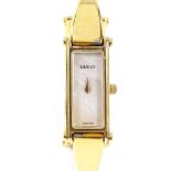 GUCCI - a lady's gold plated stainless steel 1500L quartz bangle wristwatch, rectangular mother-of-