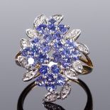 A 9ct gold blue stone and diamond cluster cocktail ring, with openwork bridge, setting height 22.