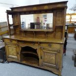 A good quality Arts and Crafts oak sideboard, by Shapland & Petter, with mirror inset back, stylised