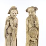 A pair of large Japanese ivory okimono, man holding a fan and a woman, Meiji Period circa 1900, on