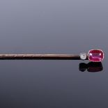 An Austro-Hungarian high carat gold ruby and paste stick pin, dog head mark in between A and