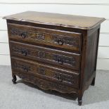 A 19th century French oak 3-drawer commode with relief carved drawer fronts, width 3'7", height 2'