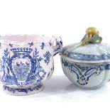 A Delft tin-glaze pottery jardiniere, with painted panel and coat of arms, height 15cm, and an