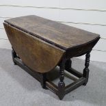 An 18th century oak oval gateleg dining table, 4'2" across