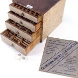 HOROLOGY INTEREST - watchmaker's chest of drawers, containing various size watch glasses, and a 1921