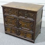 An early 18th century joined oak chest of 3 long drawers, with moulded fielded panelled drawer