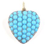 An unmarked gold blue stone pave-set heart pendant, height excluding bale 27.7mm, 9g
