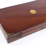 A brass-bound mahogany gun box, with fitted interior for a pair of pistols, label for Robert