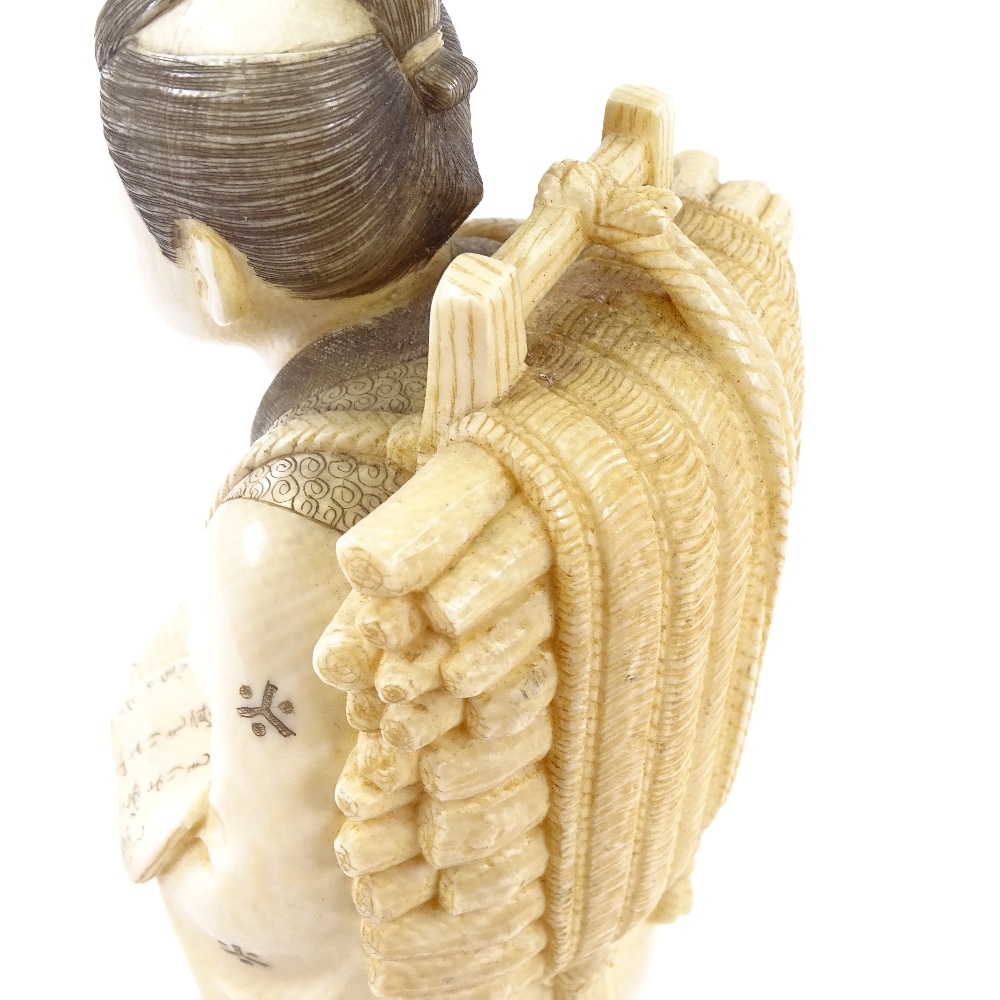 A Japanese ivory okimono, man carrying kindling wood and a book, Meiji Period, signed under base, - Image 5 of 6