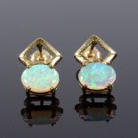 A pair of 9ct gold opal earrings, stud fittings with openwork settings, height excluding fitting