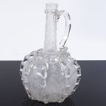 A Venetian style clear glass wine flagon, with vertical trials and engraved birds, height 20cm