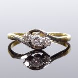 An 18ct gold 3-stone diamond crossover ring, total diamond content approx 0.2ct, setting height 6.