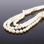 A triple strand cultured pearl collar necklace, on 9ct foliate engraved clasp, necklace length