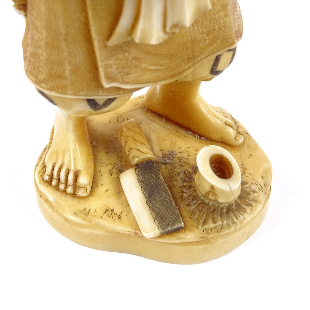 A Japanese 2-tone stained ivory okimono, man carrying an infant, Meiji period, signed under base, - Image 7 of 8