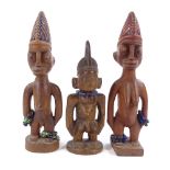 3 African Yoruba Ibejis, carved wood with bead mounts, height 30cm