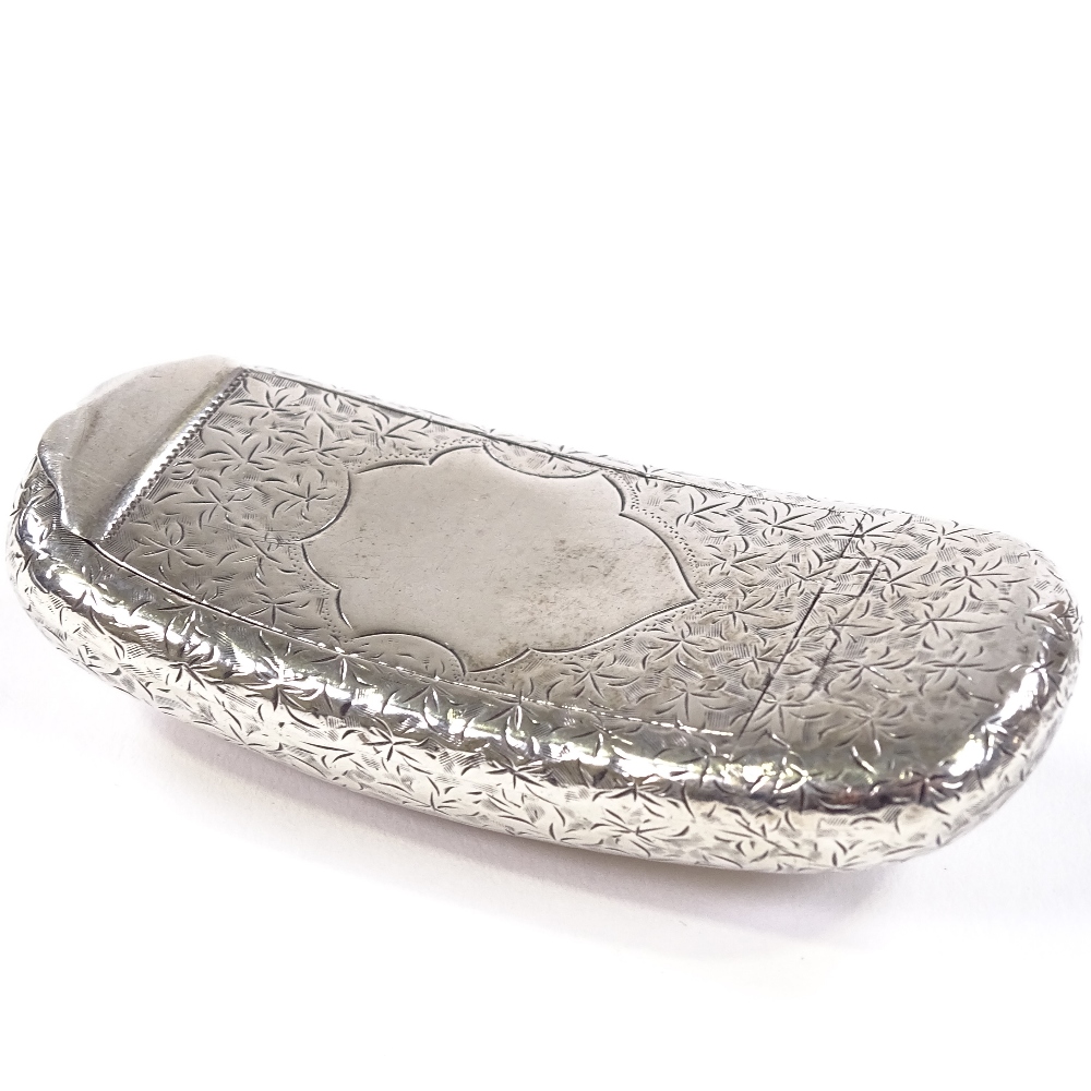 An Edwardian silver curved snuffbox, allover engraved floral decoration with vacant cartouche,