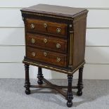 A small 19th century mahogany chest of 3 drawers on stand, with parcel gilt fluted corner columns,