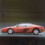 An original 1985 Ferrari Testarossa factory advertising sales poster, in original frame, 40" x 28"