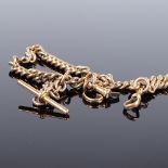A 9ct rose gold curb link Albert chain, with 2 dog clips and a suspended T-bar, chain length 36cm,