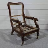An early 19th century Daws type mahogany-framed reclining library armchair with pull-out leg rest,