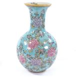 A Chinese narrow-neck vase with floral design on turquoise ground, 20th century, height 35cm