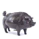 A Victorian bronze butcher's shop counter bell in the form of a pig, with clockwork mechanism in