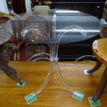 A contemporary design circular glass-top table, on a perspex splayed 3-leg base, W67cm, H69cm