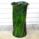 A green glazed pottery stick/umbrella stand, height 53cm