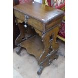 A Victorian Gothic oak work table, with fitted interior, raised on pierced tablet supports, W46cm,