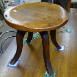 An oak revolving stool, H46cm