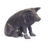 A painted cast-iron pig money bank, length 25cm