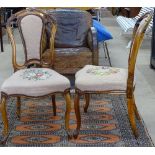 A pair of Antique walnut side chairs, with carved acanthus leaf top rails, needlework upholstered