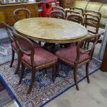 A Victorian burr-walnut oval loo table, raised on a carved sabre leg base, together with a set of