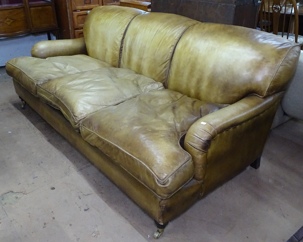 A Howard style leather upholstered 3-seater sofa with loose seat cushions, L200cm, H80cm, seat