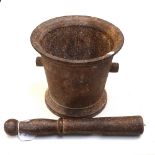 A cast-iron bell-shaped pestle and mortar, mortar height 16cm