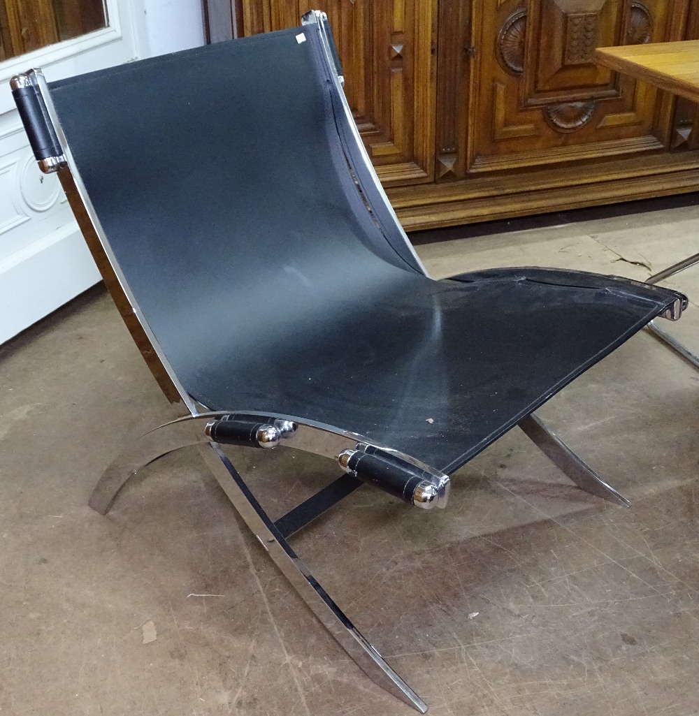 A contemporary Danish design heavy chrome and leather sling lounge chair