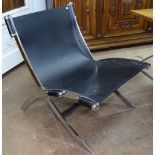 A contemporary Danish design heavy chrome and leather sling lounge chair