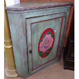 An Antique painted hanging corner cupboard, with shaped shelves and panelled door, W85cm