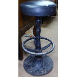 An Art Nouveau style bar stool with cast-iron base